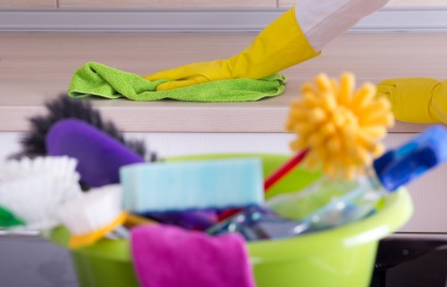 Professional office cleaners working in a SW20 workplace